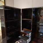 Warm Beige Stone-Pattern Double-Door Wine Cabinet with Dark Wood Interior, Built-In Drawers and Sculptural Metal Legs